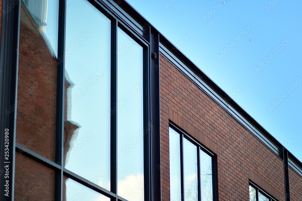 Sky reflected in a modern building glass facade