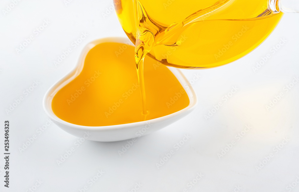 Pour the flowing golden yellow vegetable oil linseed oil