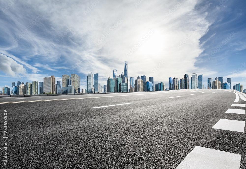 Empty asphalt road and panoramic city skyline with buildings in Shanghai