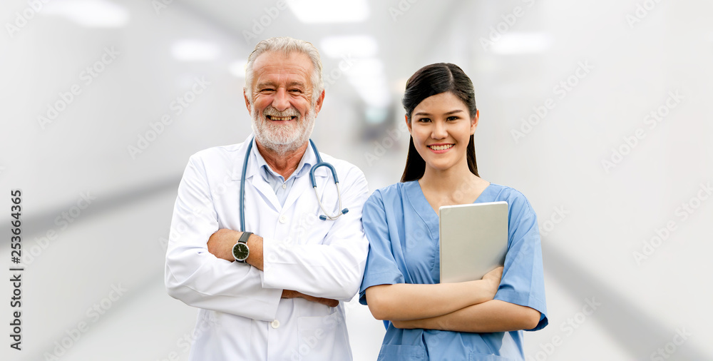 Senior doctor working with young doctor in the hospital. Medical healthcare staff and doctor service