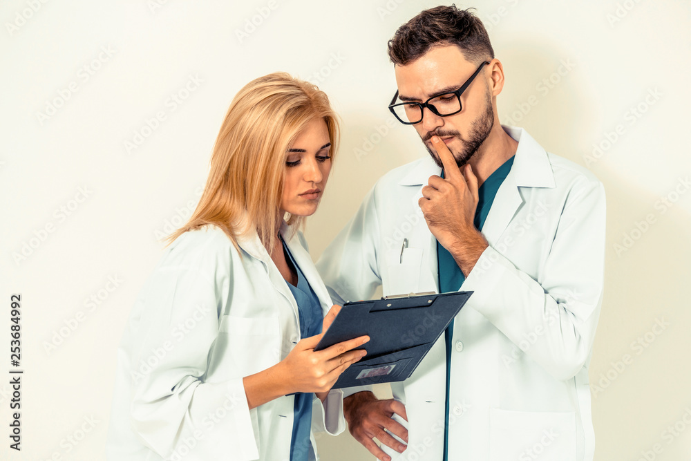 Young doctors coworker thinking on white background. Healthcare and medical service concept.