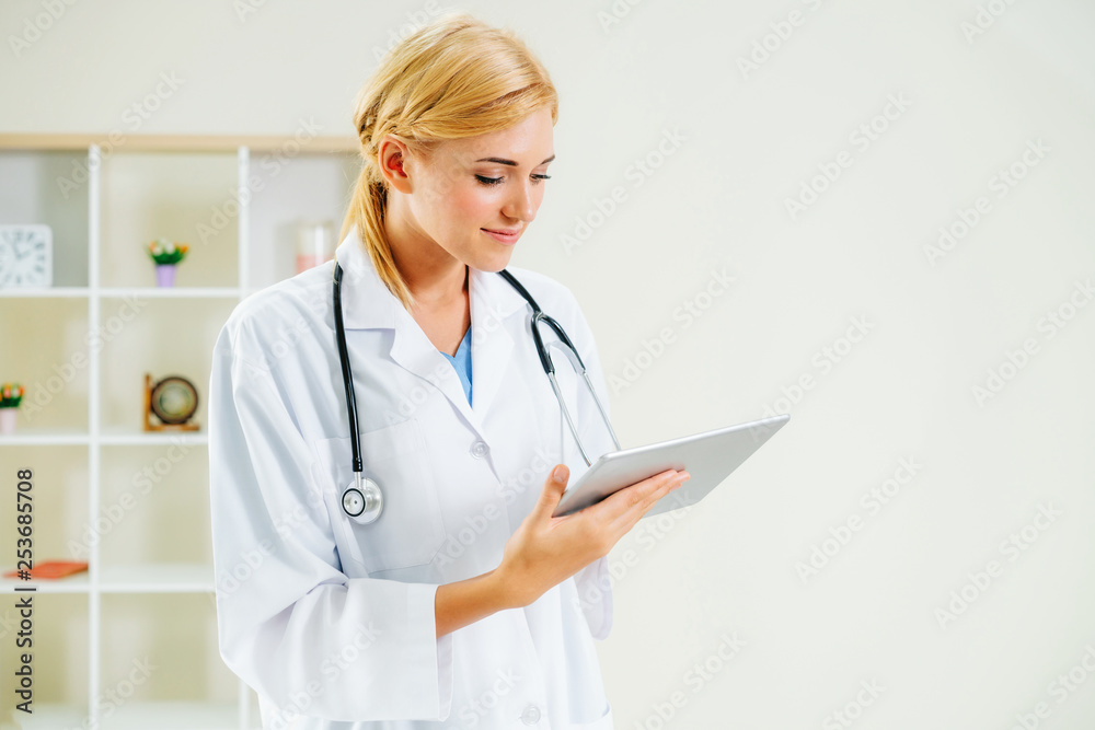 Young female doctor working in hospital office. Medical and healthcare concept.