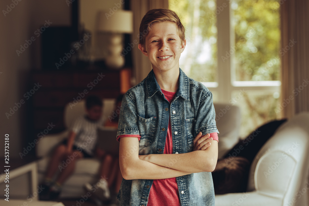 Smiling boy standing at home