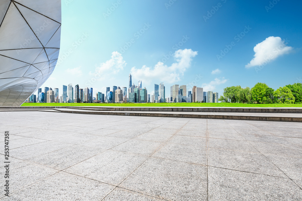 Empty square floor and panoramic city skyline with buildings in Shanghai