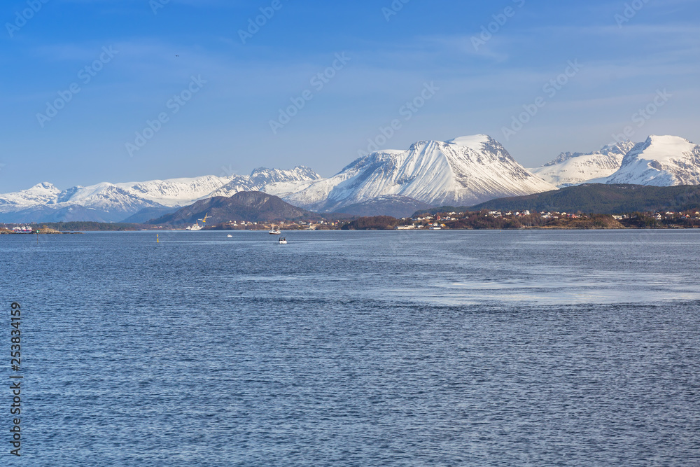 Coastline of Alesund with snowy mountains, Norway