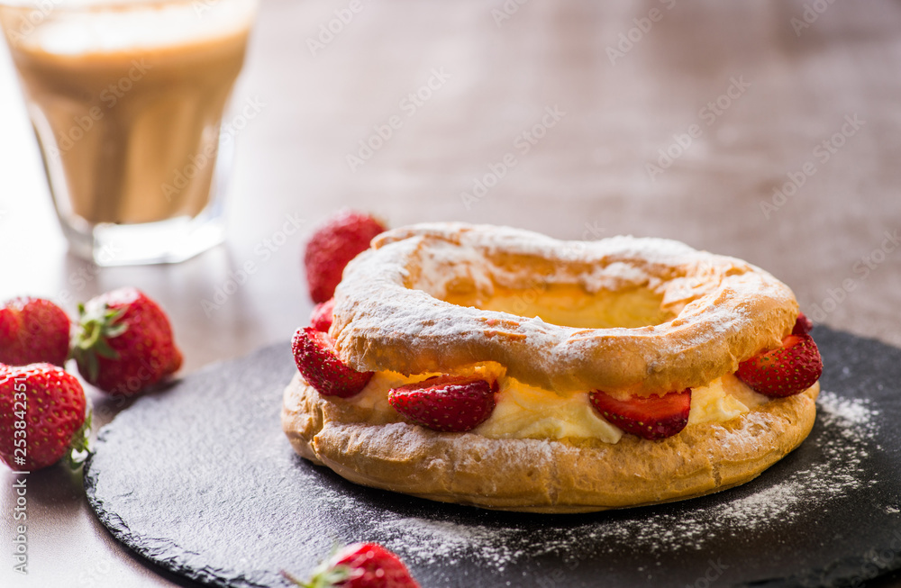 custard cake with strawberries and a cup of coffee