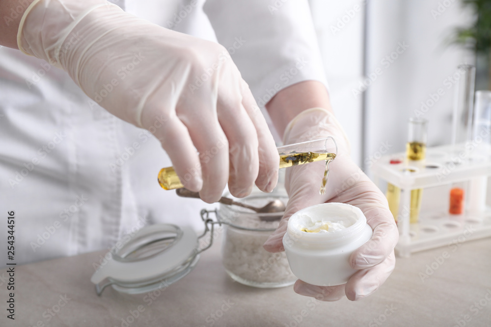 Beautician preparing natural cosmetics, closeup