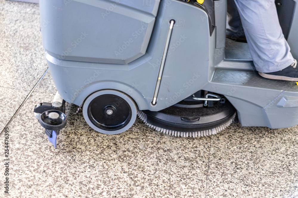 cleaning the floor with vacuum cleaner