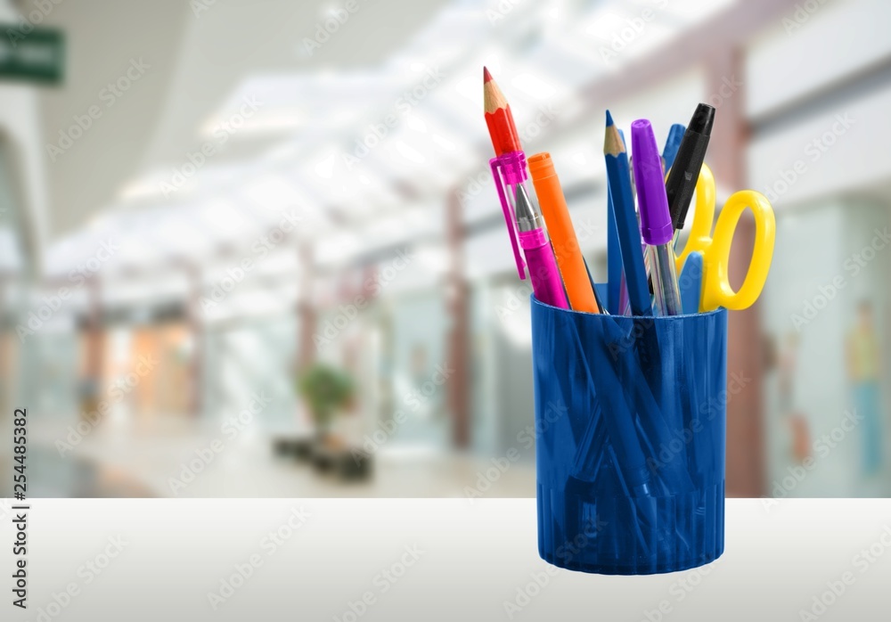 School Backpack with stationery on wooden table