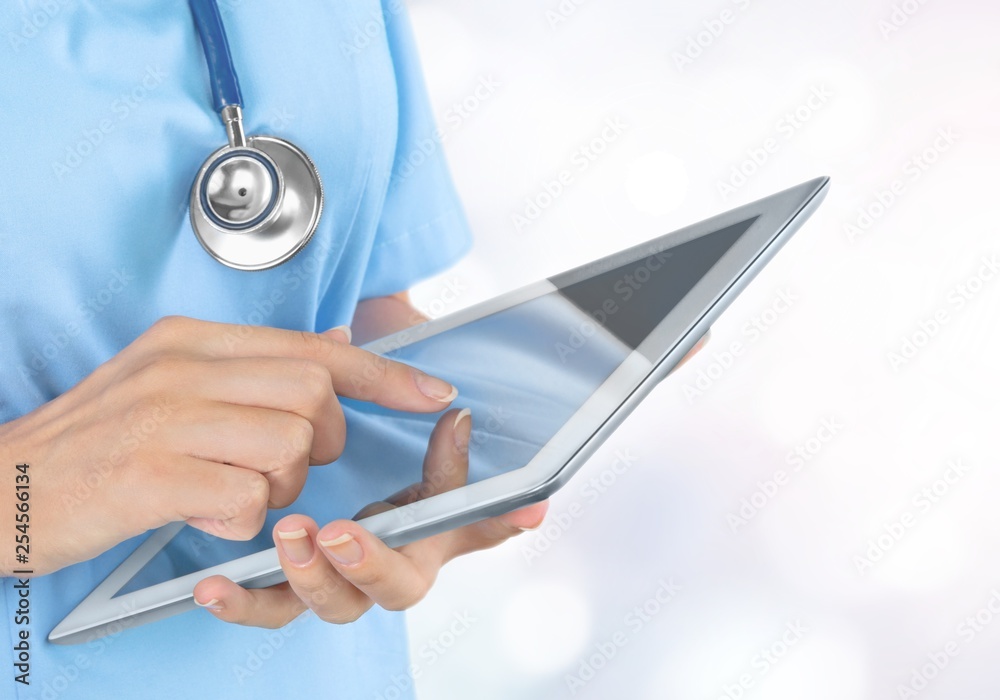 Close-up Doctor at hospital working with tablet pc