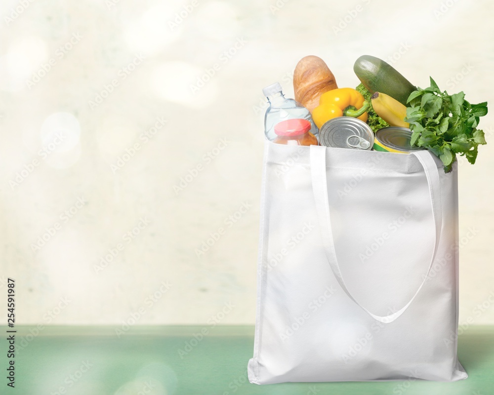 Shopping bag with groceries isolated on white background