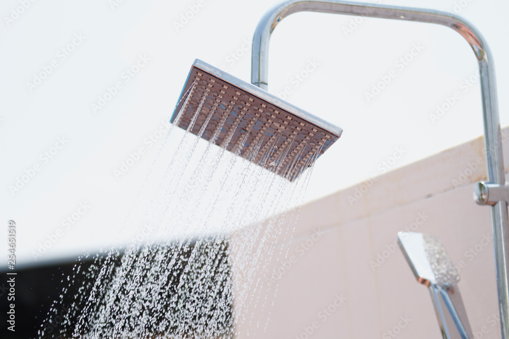 Water flowing from shower at bathroom outdoor