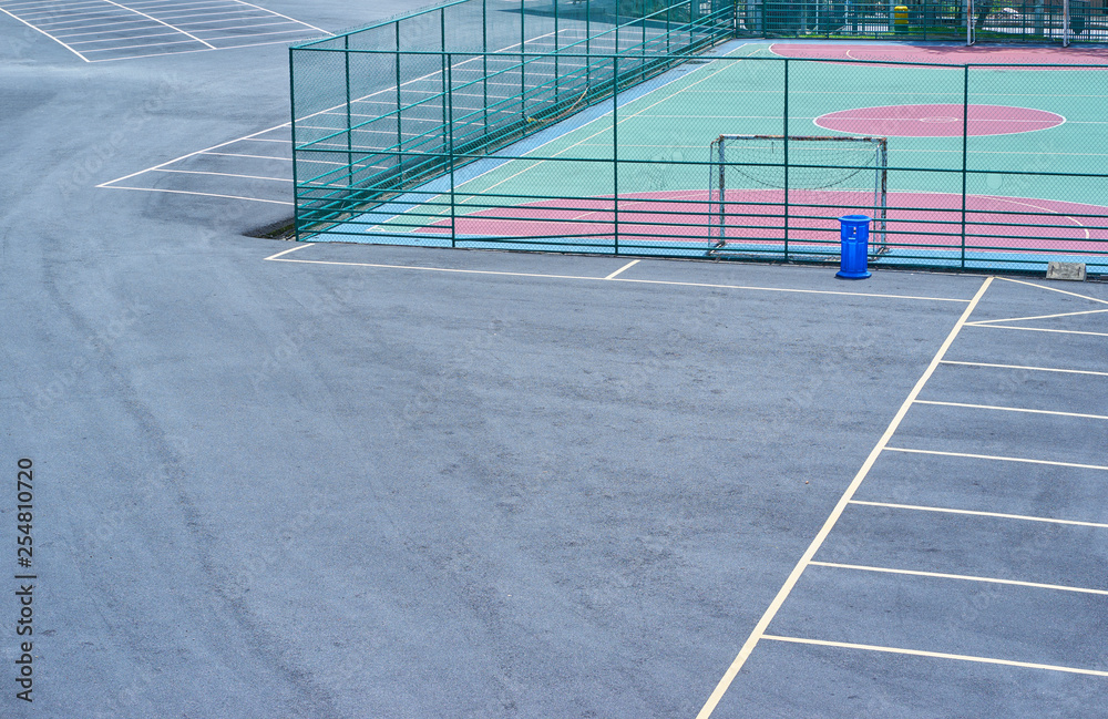 Asphalt parking floor with soccer playground .