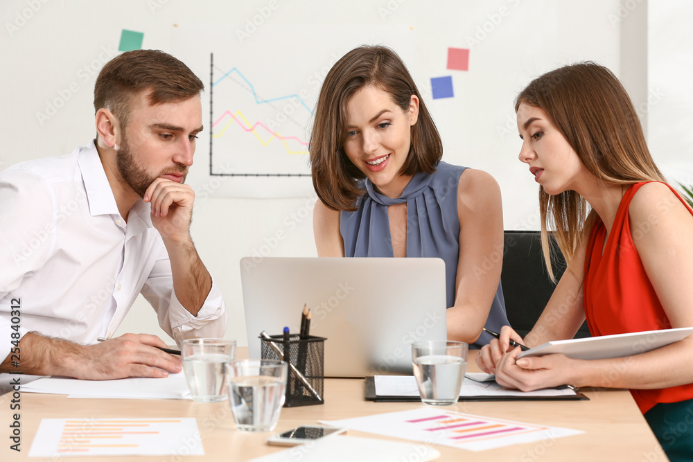 Young business people at meeting in office