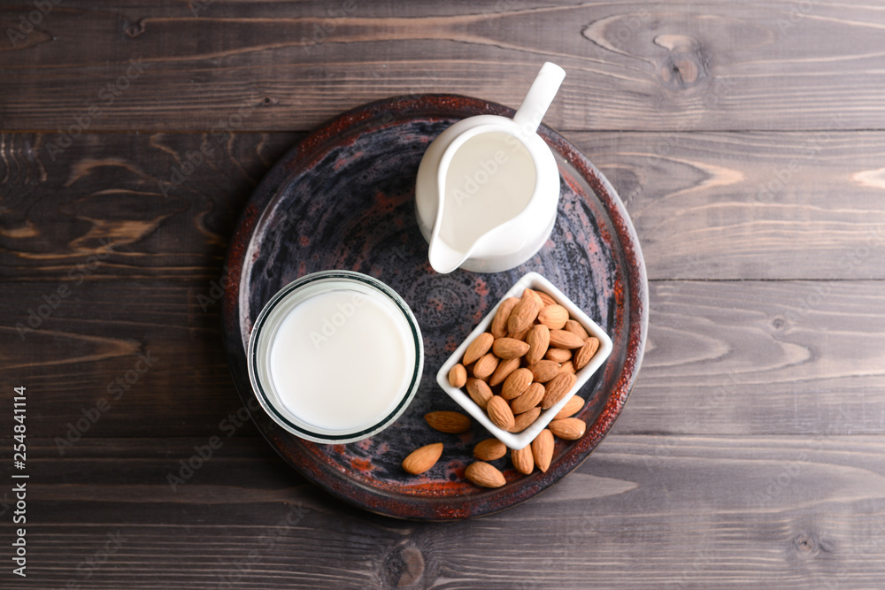 Composition with healthy almond milk on table