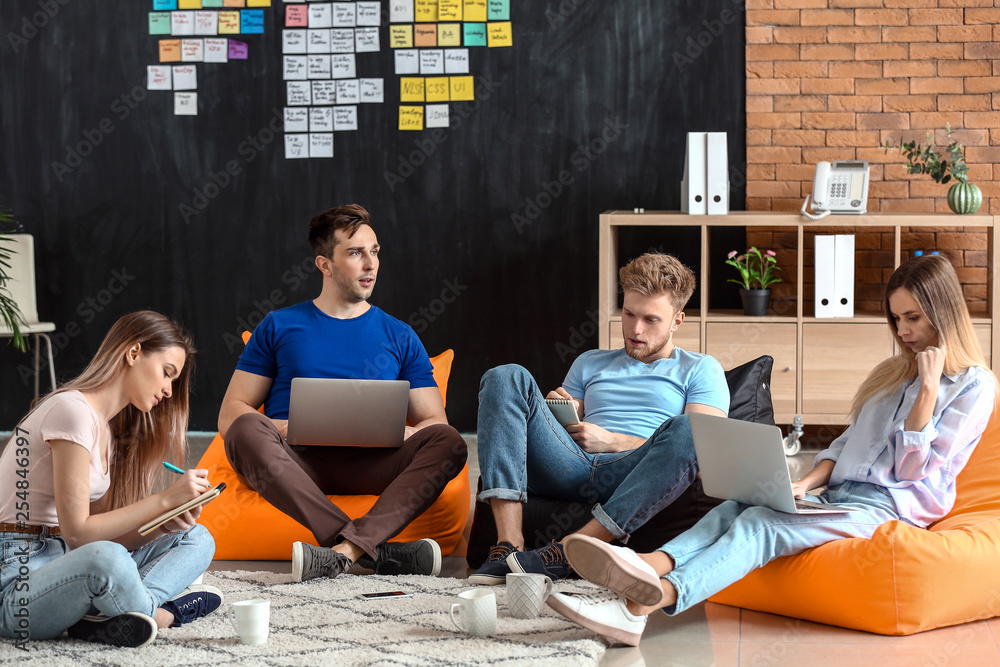 Young IT specialists working in modern office