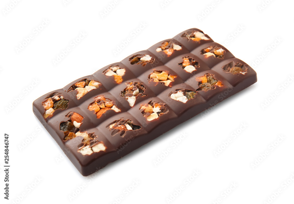 Tasty milk chocolate with candied fruit and nuts on white background