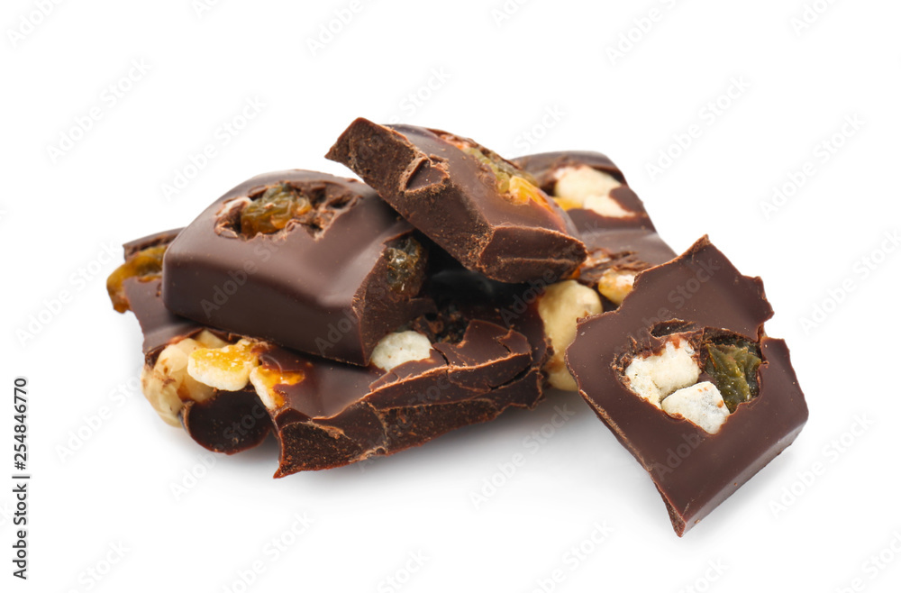 Tasty milk chocolate with candied fruit and nuts on white background