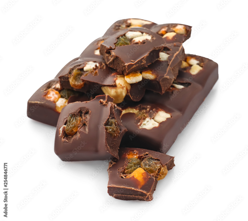 Tasty milk chocolate with candied fruit and nuts on white background