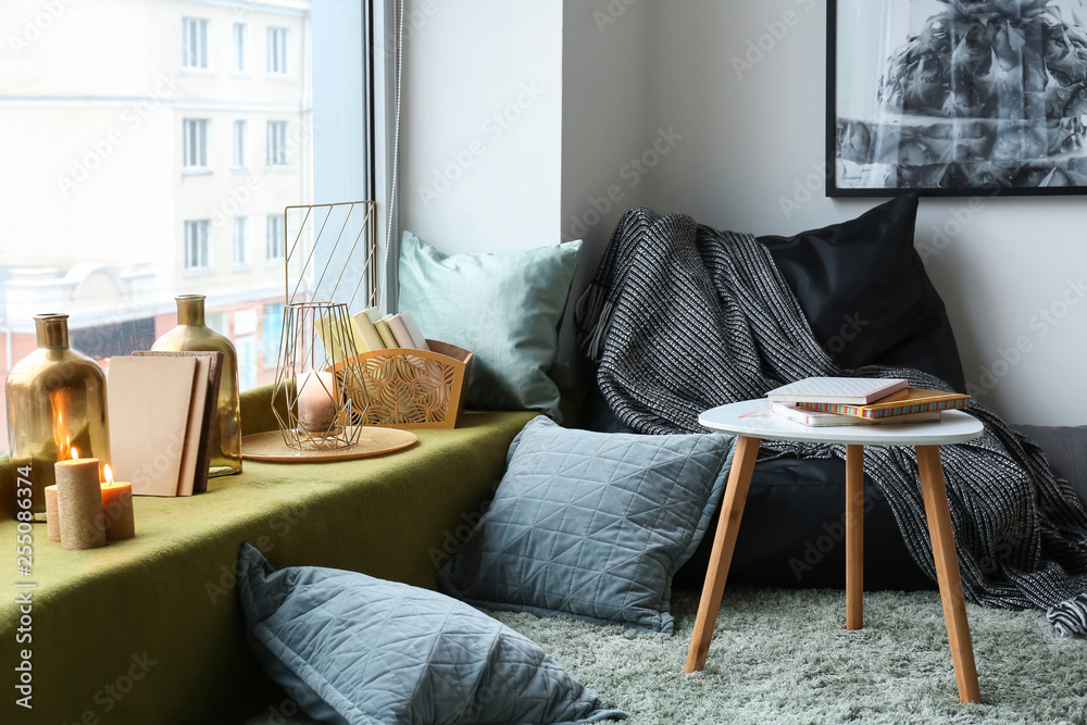 Cozy place near window with golden decor