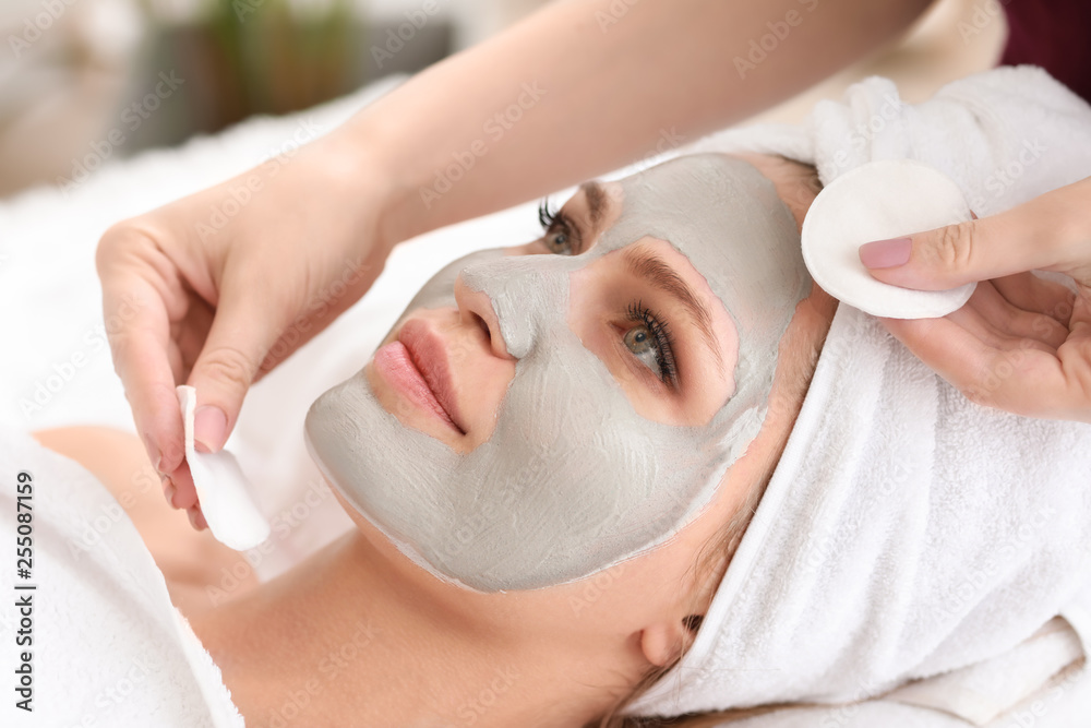 Young woman undergoing treatment in beauty salon