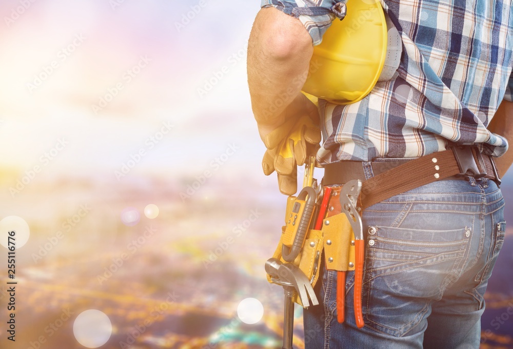 Worker with a tool belt. Isolated over  background.