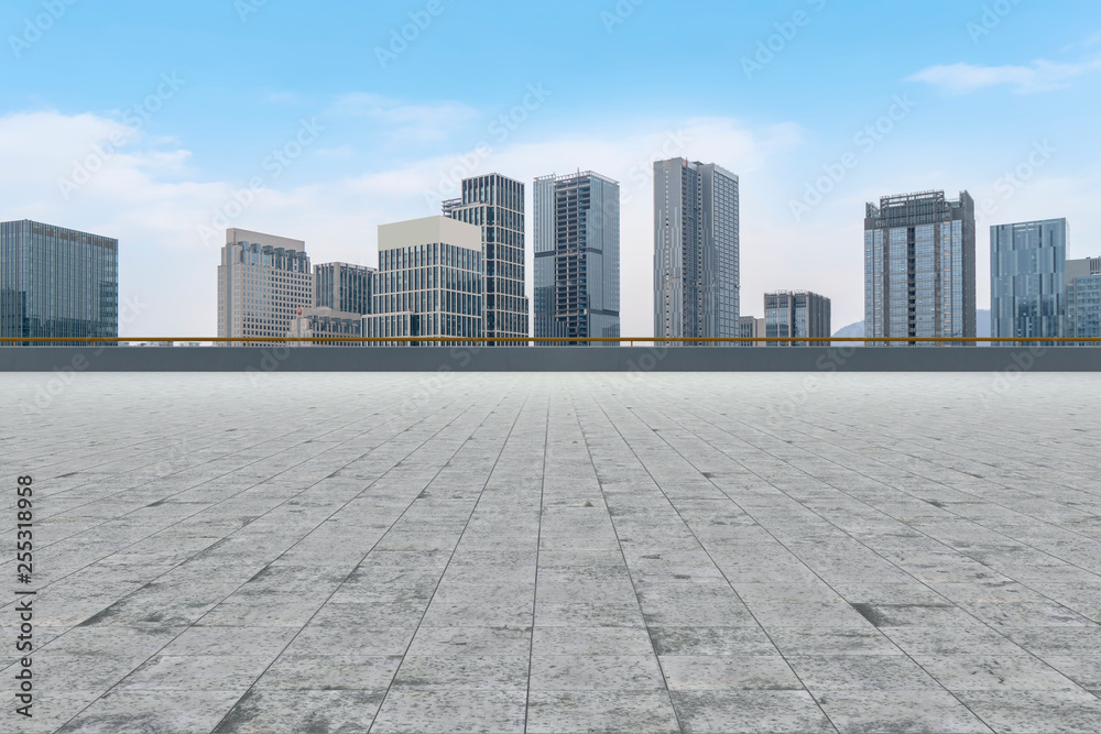 Urban skyscrapers with empty square floor tiles