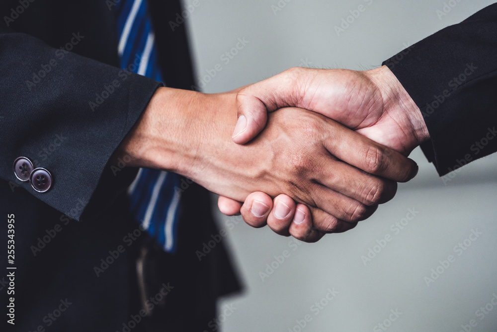 Business people agreement concept. Businessman do handshake with another businessman in the office m