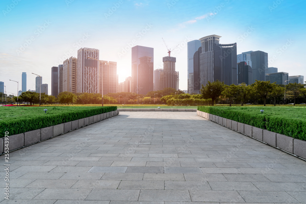 Urban skyscrapers with empty square floor tiles