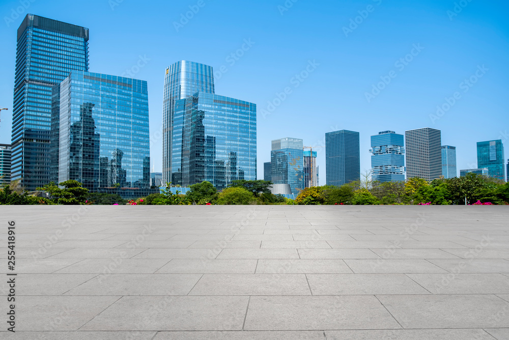 Urban skyscrapers with empty square floor tiles