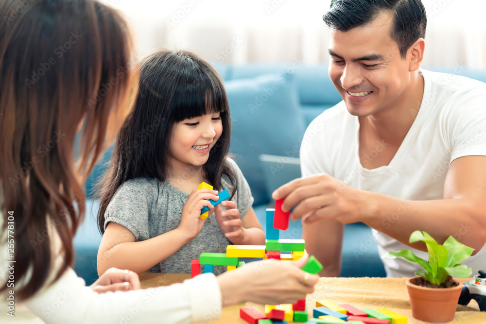 happy family caucasian and asian mixed race with pretty daughter enjoy family time with toy  togethe