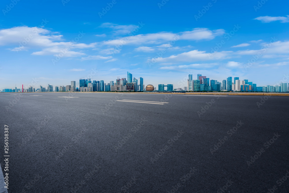 Foreground highway asphalt pavement city building commercial building office building