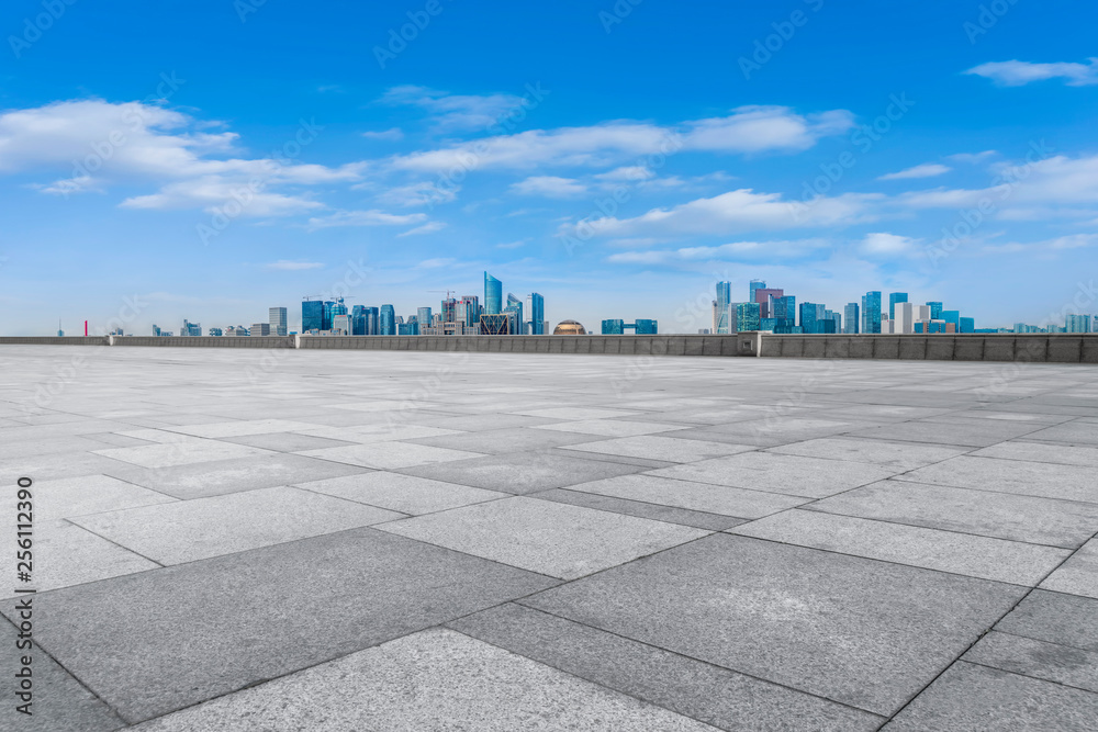 Urban skyscrapers with empty square floor tiles