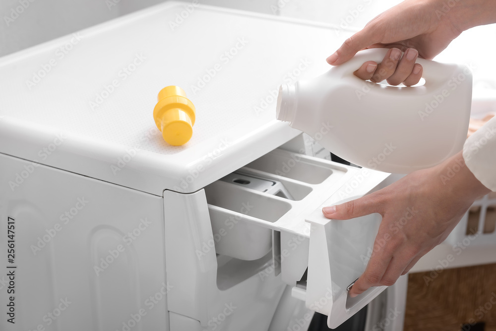 Woman doing laundry at home