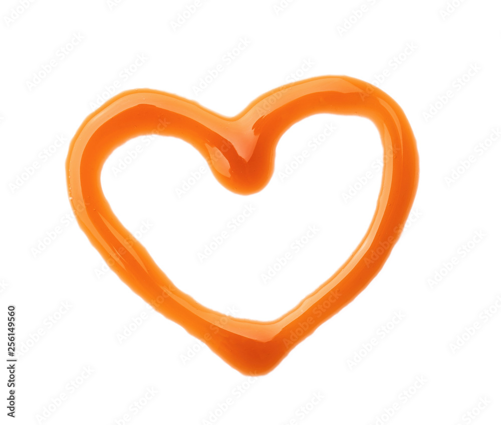 Heart made of liquid caramel on white background