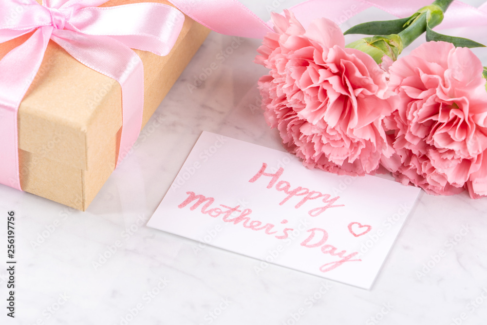 May mothers day handmade giftbox idea concept, beautiful blooming carnations with baby pink ribbon b