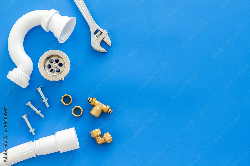 Plumber work with instruments, tools and gear on blue background top view mockup