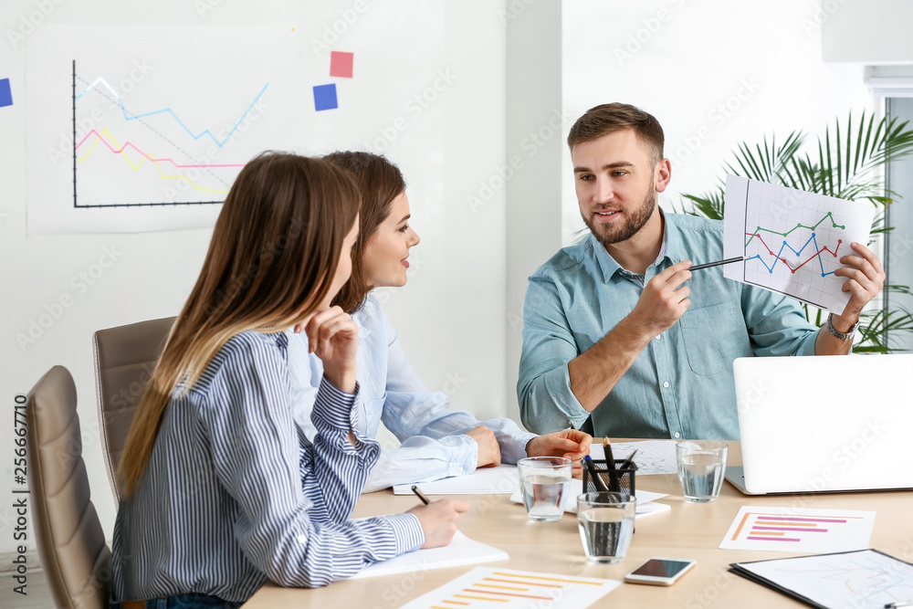 Young business people at meeting in office