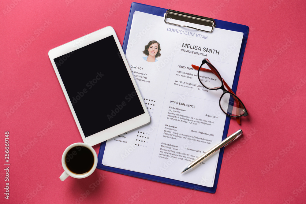 Job resume with tablet PC on color background