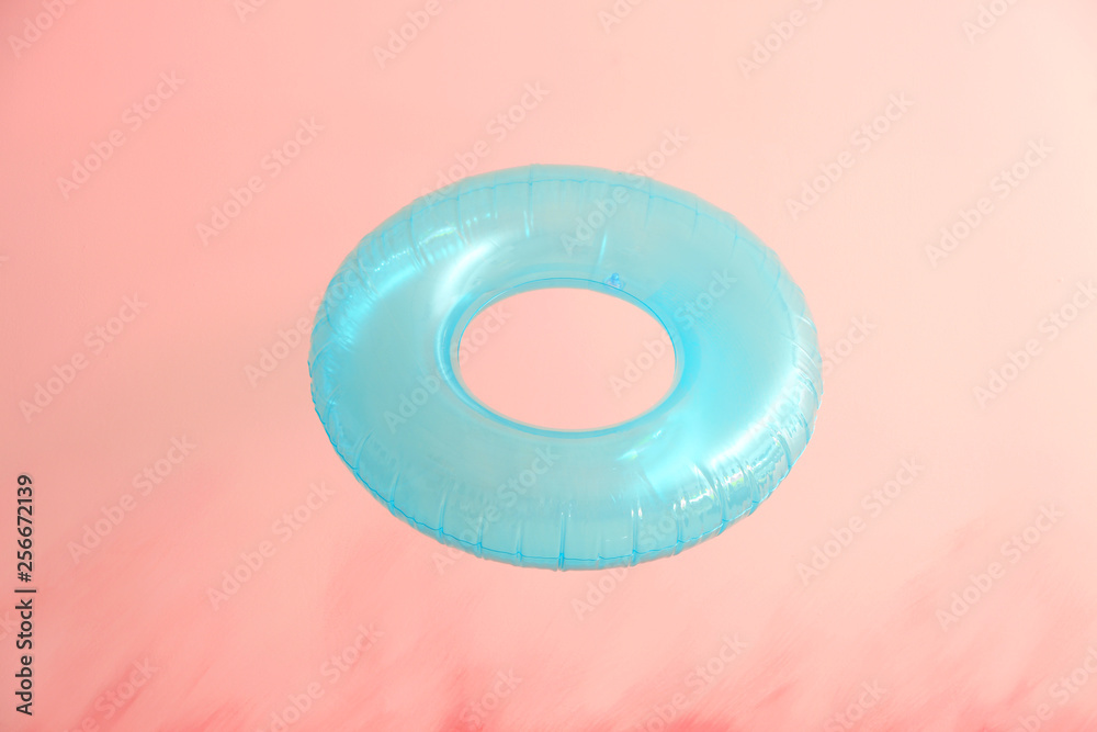 Inflatable ring on color background