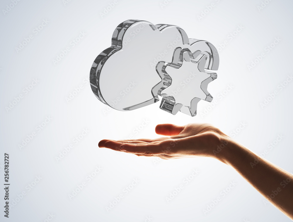 Cloud computing concept with glass symbol shown in hand