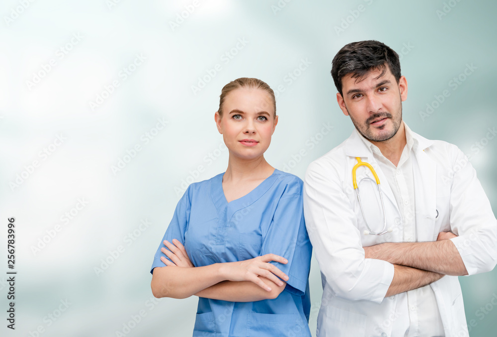 Doctors at hospital office working with another doctor. Healthcare and medical services.