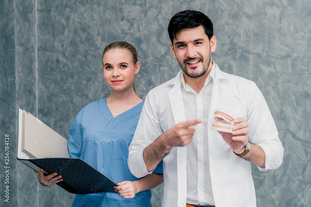 Dentist and nurse assistant working in dental office at the hospital. Dentistry concept.