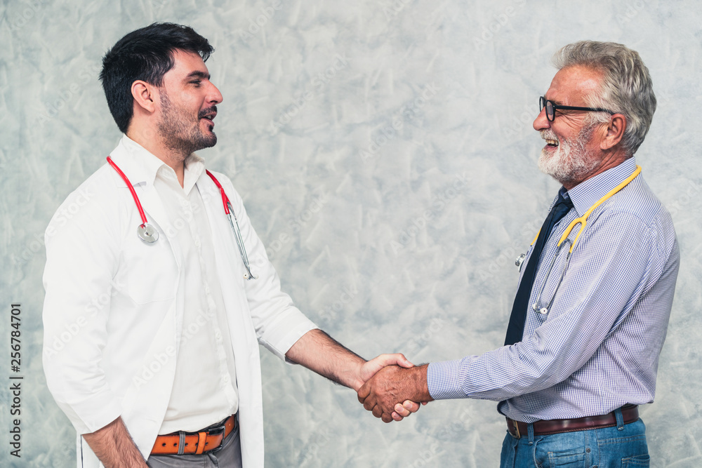 Doctor in hospital handshake with another doctor. Healthcare people teamwork and medical staff servi