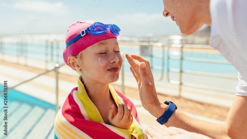 Girl getting skin care after swimming lessons