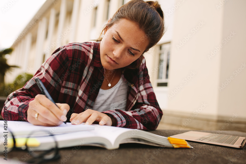 College girl studying at campus