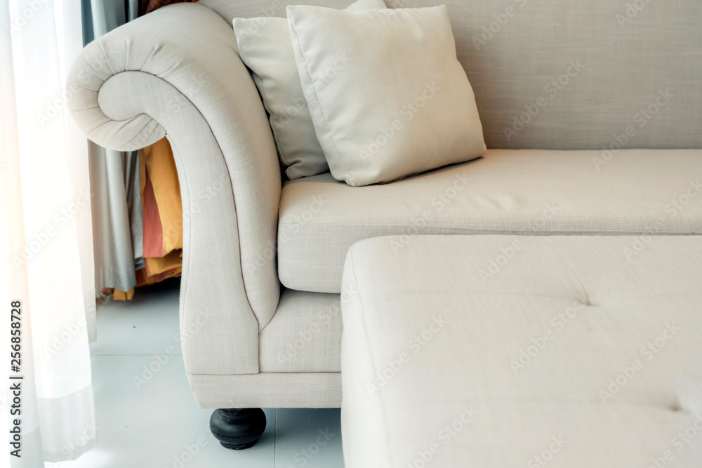 contemporary interior of Living room with part of sofa in sunny day and white curtain interior backg