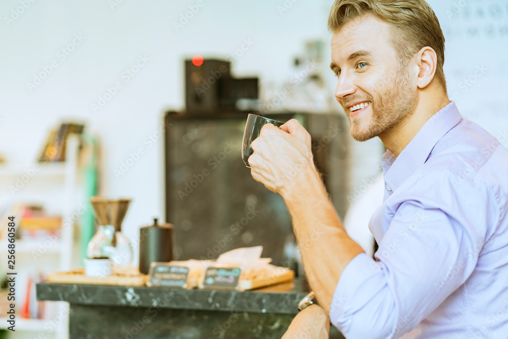 smart casual caucasian businessman in shirt with hot coffee drink in cafe background lifestyle activ