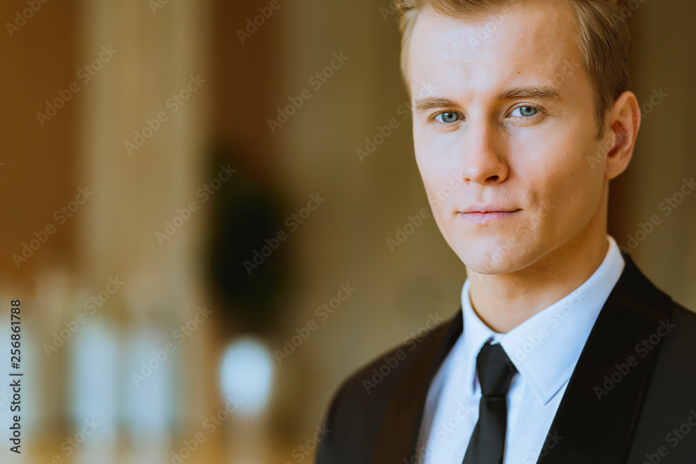 close up business caucasian man in black suit office background