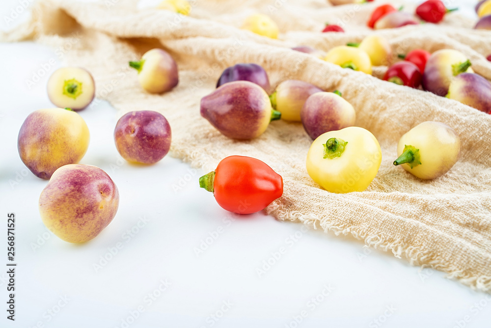 Fresh colorful peppers on burlap